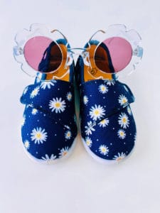 clear flower shaped glasses and navy blue shoes for girls